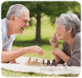Older Couple playing chess crop round